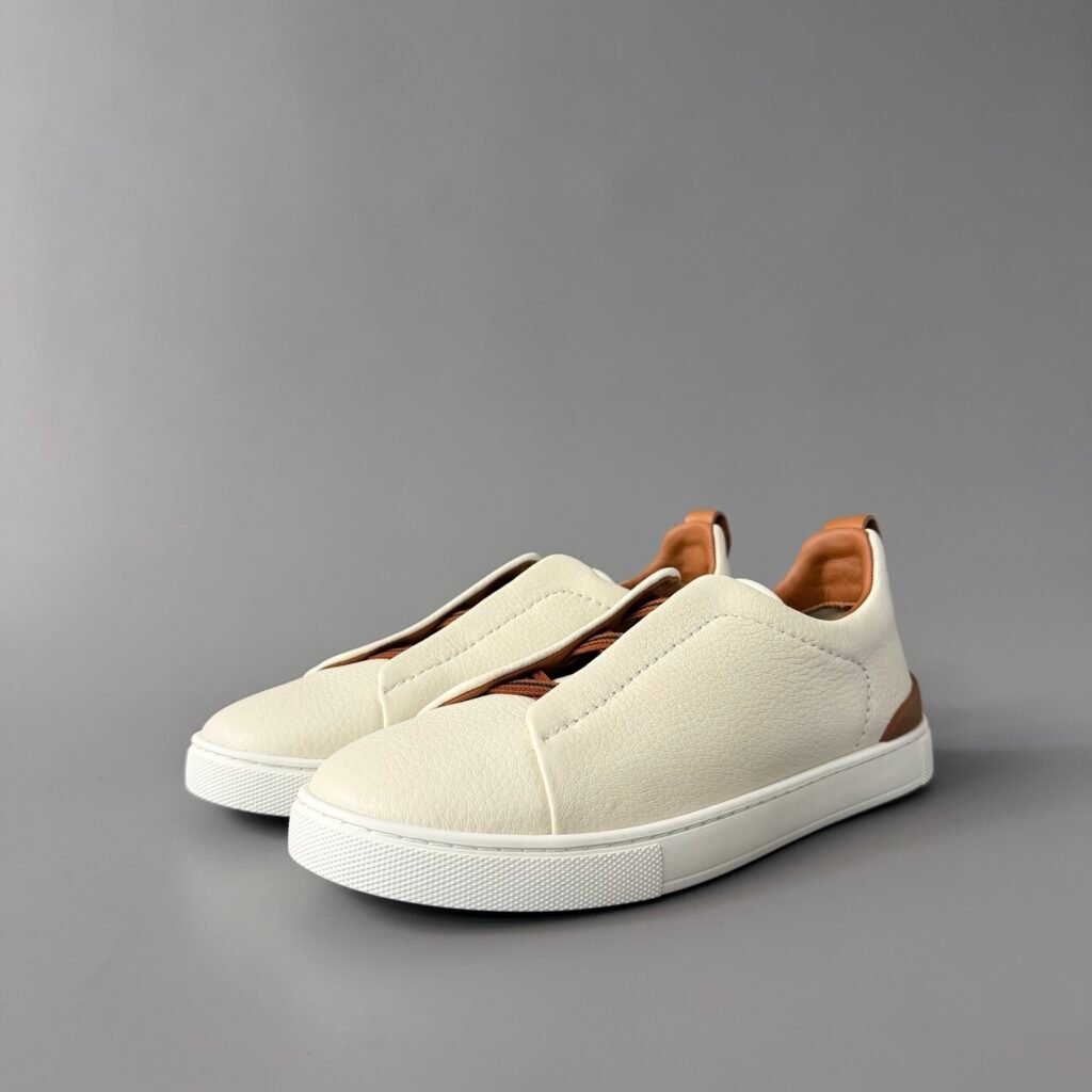 AuroraCustom ZEGNA Triple Stitch Grained Calfskin Slip-On Sneakers (Men's Off-White & Vicuña Brown Accent Edition)